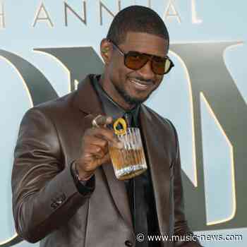 Usher kicks fan off stage after 'awkward' dance moment