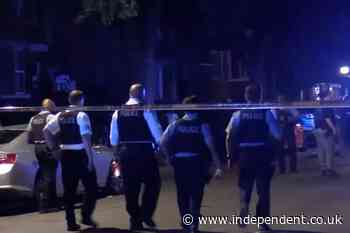 Manhunt for gunman after six injured in Chicago shooting that left two fighting for life