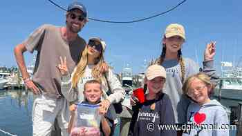 Abbey Clancy and husband Peter Crouch enjoy a chaotic fishing trip with their four lookalike children