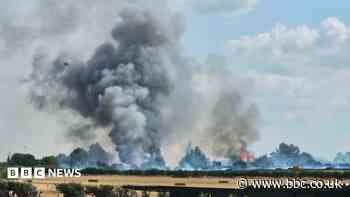 More than 60 firefighters tackle grassland blaze