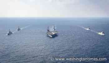 Navy carrier strike group patrolling tension-filled South China Sea
