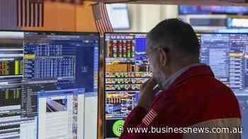 Wall St ends mixed as investors focus on tech earnings