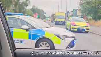 Salford incident LIVE as busy road taped off with police and paramedics on scene