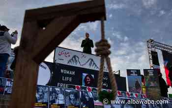 Iran hangs two protesters in public