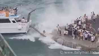 Bedlam on the Amalfi Coast: As tourist season reaches its peak, passengers scream as waves slam packed ferry against pier 