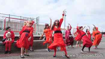 Hundreds dressed in red recreate Kate Bush’s Wuthering Heights dance