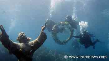 Divers restore Italy's Christ of the Abyss monument
