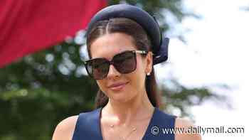 Gemma Owen looks chic in navy as she joins her proud father Michael ahead of making her jockey debut at Goodwood Festival