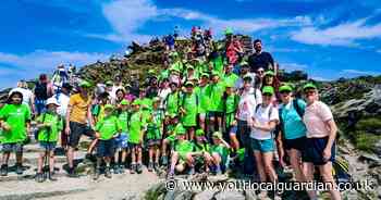 Pupils and parents climb Wales's highest mountain for charity