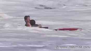 Incredible story of hero lifeguard aged just SIXTEEN filmed rescuing boy, 10, from ferocious California surf