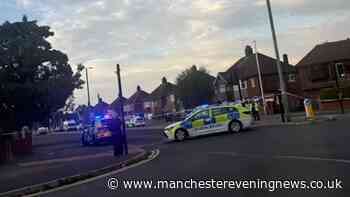 'Massive police presence' in Moston as road blocked off and ambulances at scene