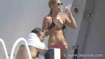 Jennifer Aniston, 57, does AB WORKOUTS as she holidays with boyfriend Jim Curtis and Friends pal Courteney Cox