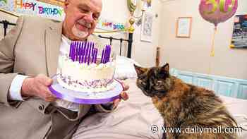 Meet Millie, 'the world's oldest cat', who lives on a diet of salmon, prawns, chicken and tuna...
