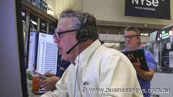 Wall St ends mixed as investors await tech earnings