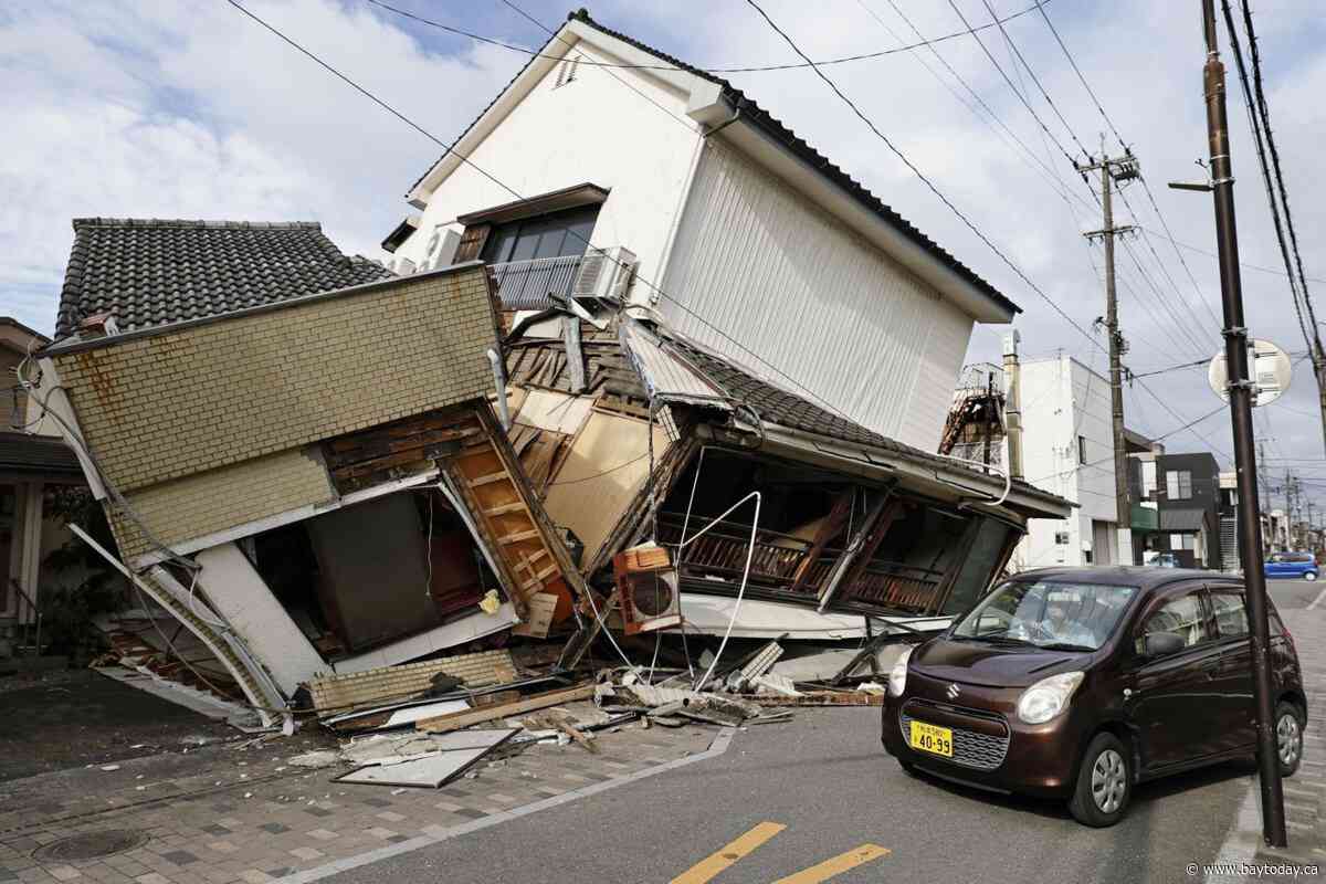 Death toll rises to 13 as rescuers search for the missing after Japan earthquake