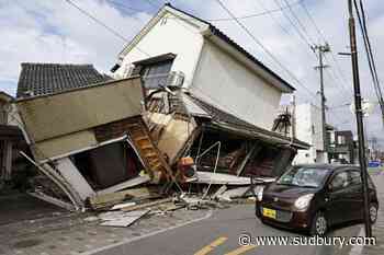 Death toll rises to 13 as rescuers search for the missing after Japan earthquake