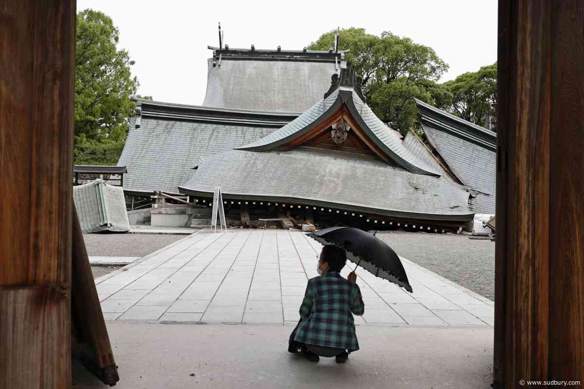 Rescuers search for the missing after Japan earthquake as death toll rises to 13