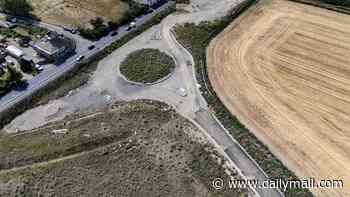 Villagers are left with a 'roundabout to nowhere' after developers ditch plans to build 300 new homes
