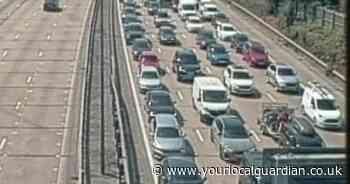 Driver treated after M25 crash between lorry and car causes major delays
