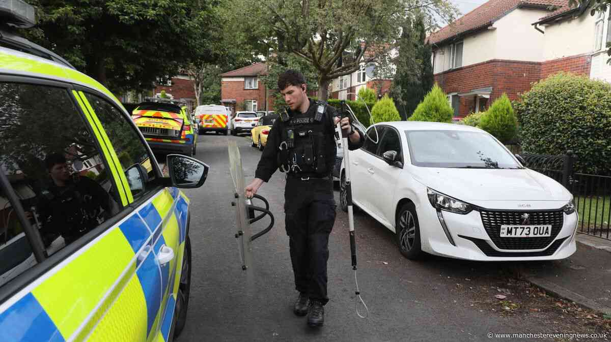 Armed police swarm Bolton street as three injured in dog attack