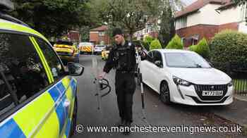 Armed police swarm Bolton street as three injured in dog attack