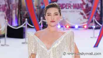 Florence Pugh looks sensational in a silver tassel gown with statement neckline as she poses at the star-studded Spider-Man premiere
