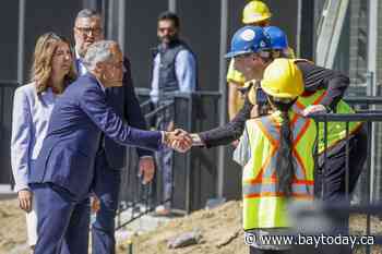 Carney comes to Alberta, talks housing, rides a sprayer, hears from separatists