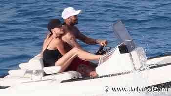 Victoria Beckham wraps her legs around husband David on speedboat while wearing skimpy swimsuit as he gives James Bond a run for his money in Formentera
