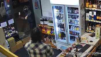Melbourne sinks to new low as thieves hurl wine bottles at store worker in bungled robbery - before one loses both shoes during getaway