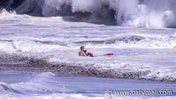 Father reveals terrifying moment his 10-year-old boy blacked out in ferocious surf before teen hero's dramatic ocean rescue: 'He knew he was drowning'