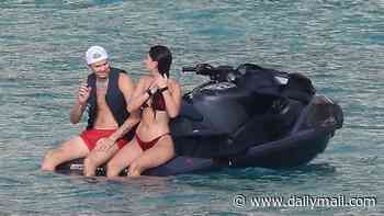 Kim Turnbull flaunts her incredible figure in a burgundy bikini as she larks around on a jet ski with boyfriend Romeo Beckham in Formentera