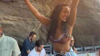 Maya Jama lets her hair down in a barely-there bikini top on a wild night out as her 'heartbroken' ex Ruben Dias shares another shirtless snap in Ibiza