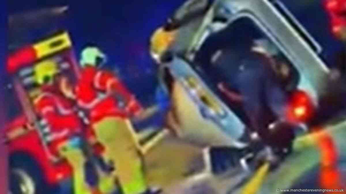 Large emergency response after car flips over in crash on busy Manchester road