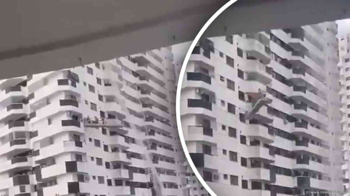 Schilders bungelen heen en weer in gondel tijdens storm in Brazilië