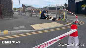 Three stabbed in flat before jumping out of window