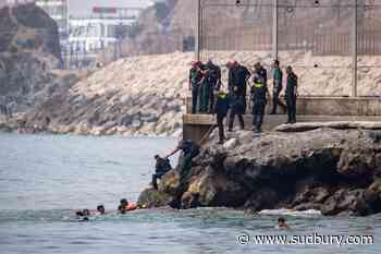 Thousands of people break through border separating Morocco from Spain's Ceuta
