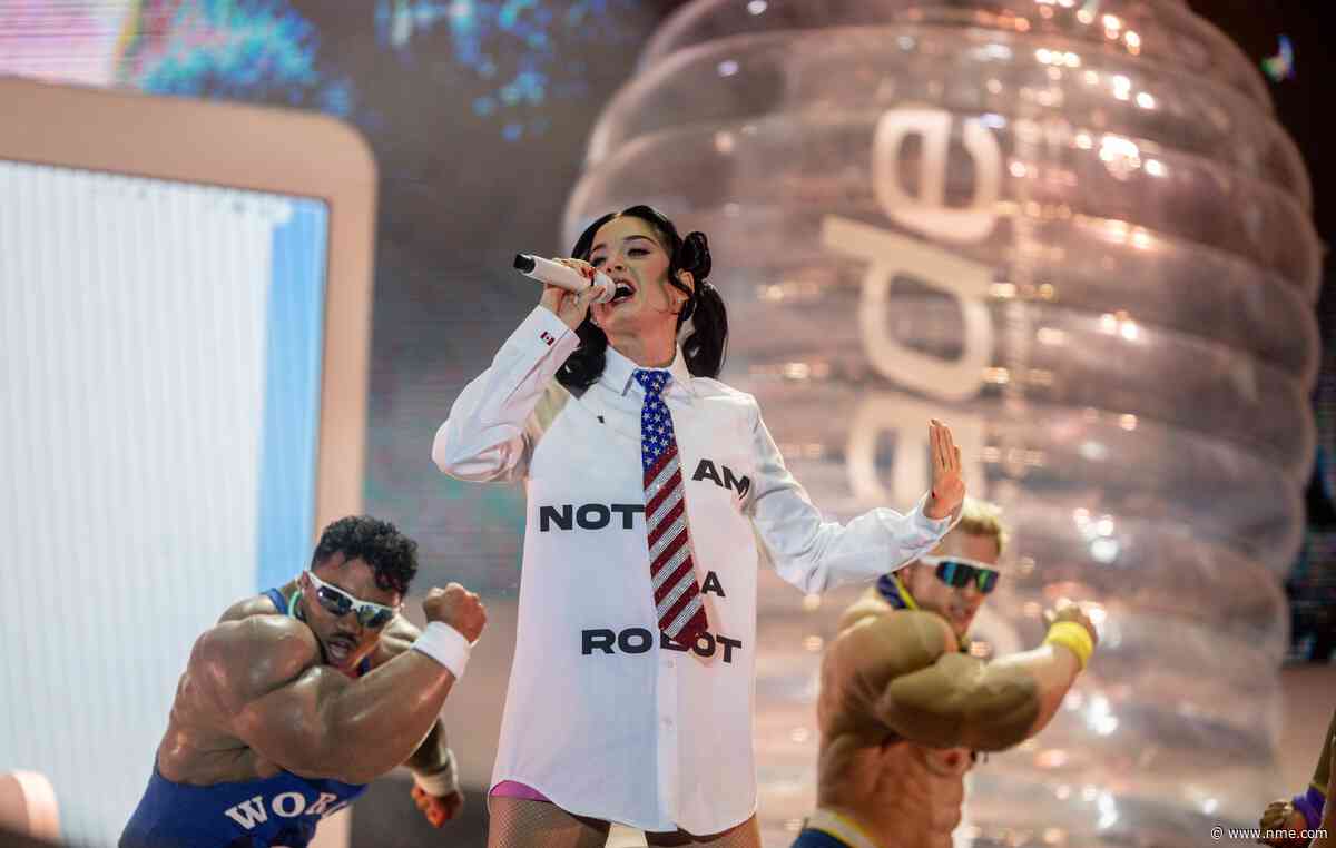Watch Katy Perry get stuck inside giant bottle as crowdsurf stunt goes wrong