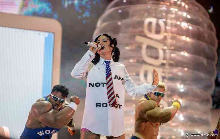 Watch Katy Perry get stuck inside giant bottle as crowdsurf stunt goes wrong