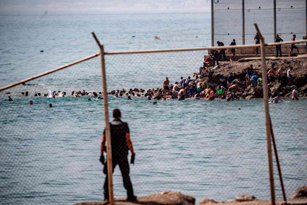 ‘Absolute chaos’ as thousands of people breach Morocco’s border with Spain's Ceuta