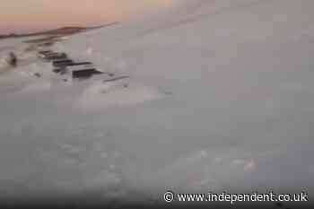 More than 200 tourists rescued from cars after massive snowstorm buries road in Argentina