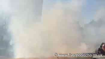 Thick smoke billows as firefighters tackle grass blaze in Everton