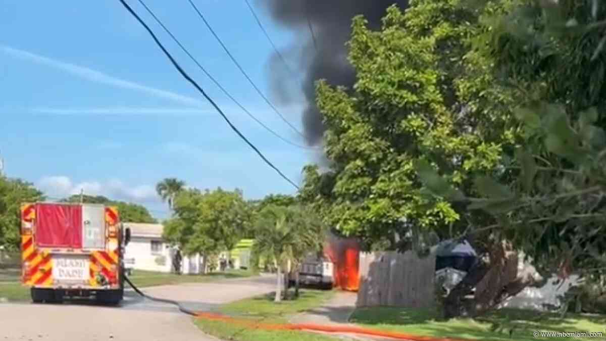 1 hospitalized after county trucks catch fire in SW Miami-Dade