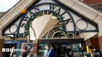 Shops to reopen after glass panel falls from roof