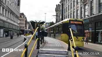 Man badly injured climbing between double tram