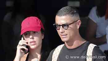 Georgina Rodríguez and Cristiano Ronaldo show off huge matching diamond rings on private jet as they are dogged by rumours they will marry in Portugal this weekend