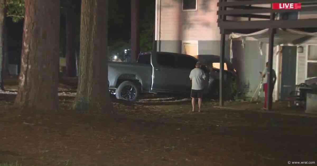Car crashes into Raleigh apartment building, passenger has minor injuries
