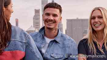 Romeo Beckham steals his father David's style in double denim as he models for new Tommy Hilfiger campaign