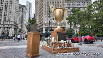 Giant trophy mocking Trump arrives in Lower Manhattan