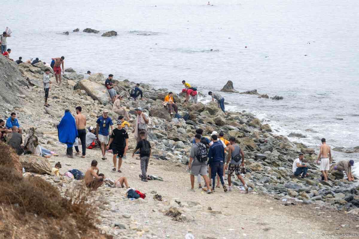 Spain’s PM blames trafficking gangs as 60,000 cross into Ceuta from Morocco, with 34 deaths
