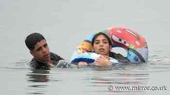 Woman’s desperate bid for land clinging to child's inflatable as 60,000 migrants enter Ceuta in border crisis